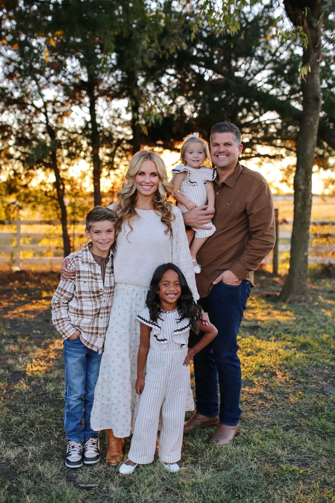 Chad Tabor with his wife and three children outdoors at sunset
